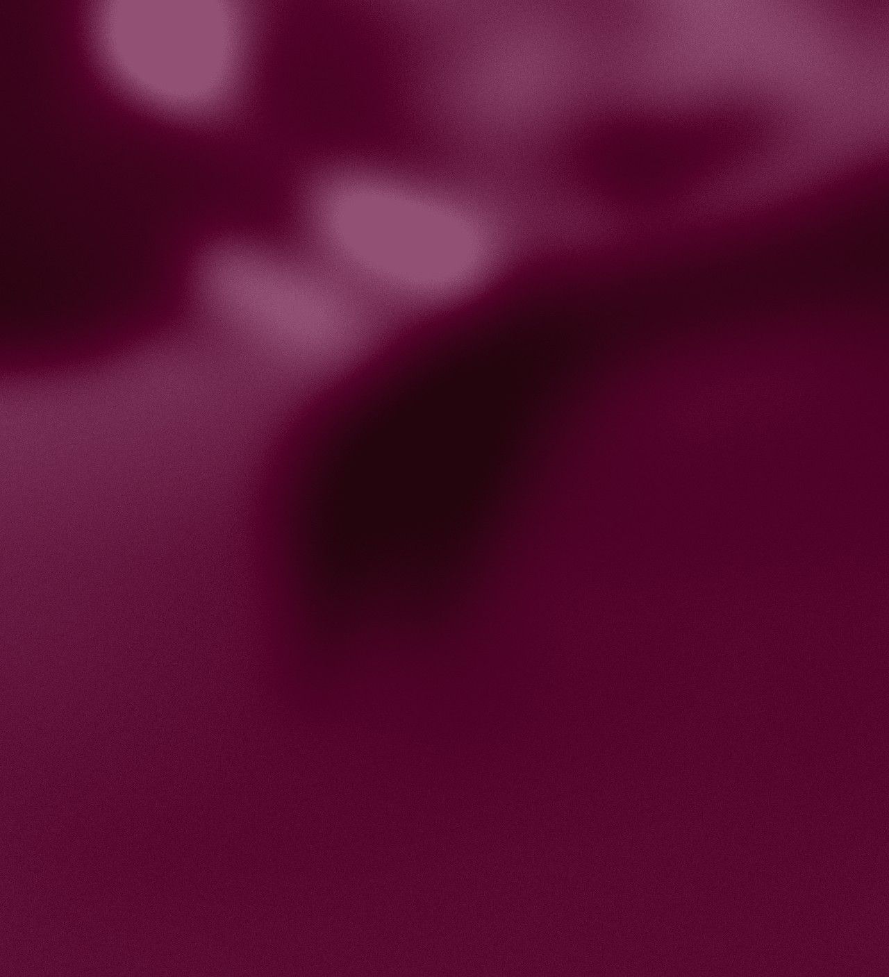 Soft, out-of-focus light in deep wine tones